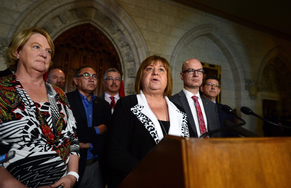 MaryAnn Mihychuk, Chair of the House of Commons Standing Committee on Indigenous and Northern Affairs, speaks in the foyer of the House of Commons along with committee members on Parliament Hill in Ottawa on Monday, June 19, 2017, regarding the committee's ninth report, which examined suicide in Indigenous communities. 