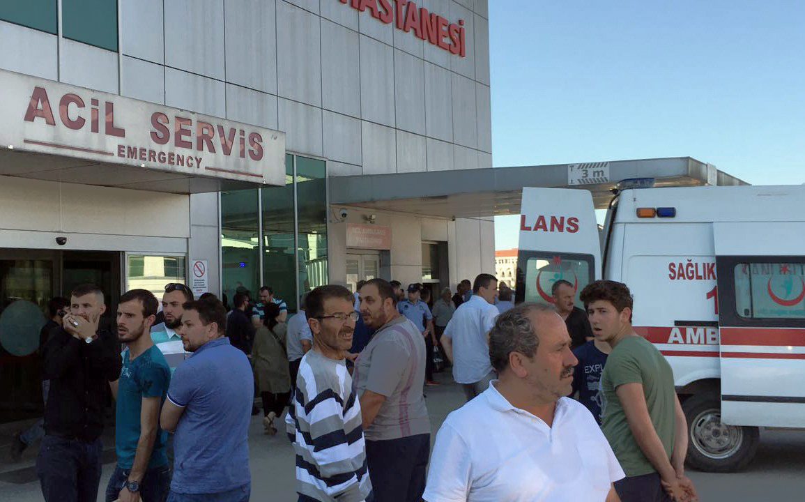 People wait outside a hospital after where the victims were taken.
