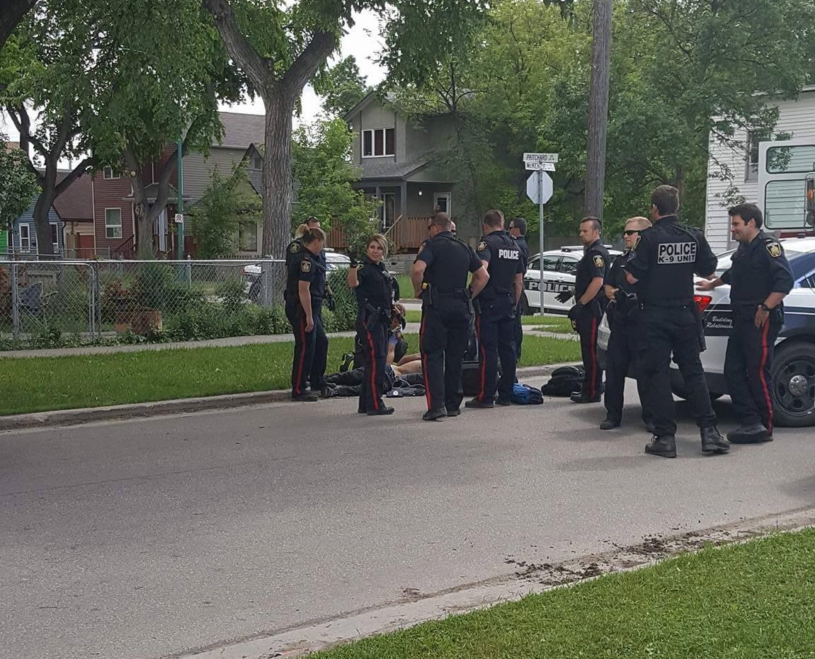 Winnipeg police say a man armed with a knife and scissors yelled at officers to shoot him. 