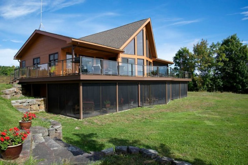 This 4,000-square-foot home features over sized windows that frame Washademoak Lake.