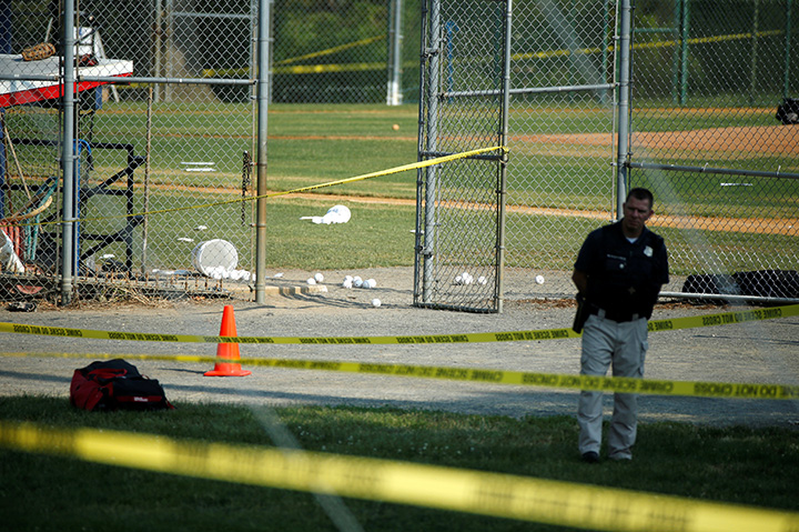 A police officer mans a shooting scene after a gunman opened fire on Republican members of Congress during a baseball practice near Washington in Alexandria, Virginia, June 14, 2017. 