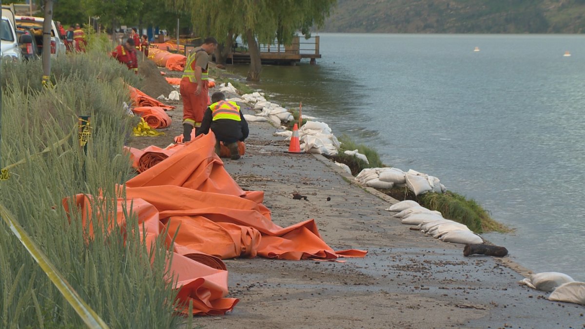 Crews roll Tiger Dam in Peachland Thursday night after recovering it from Okanagan Lake. 