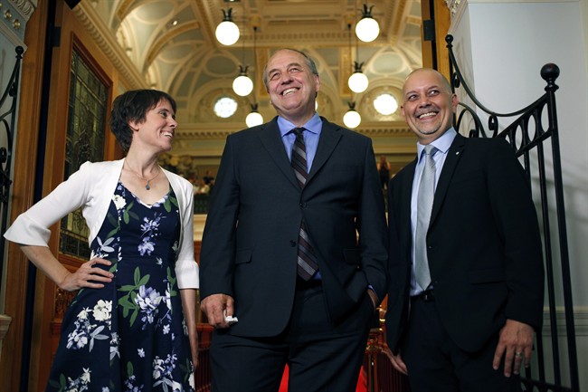 B.C. Green Caucus elected MLA's Sonia Furstenau, Andrew Weaver and Adam Olsen wait outside the legislative assembly before officially being sworn in as members during a ceremony at Legislature in Victoria, B.C., on Wednesday, June 7, 2017.