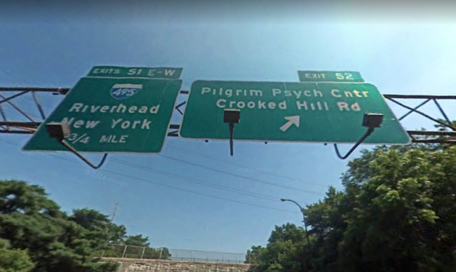 A road sign marking the exit for Crooked Hill Road on Sagtikos Parkway, Long Island, New York.