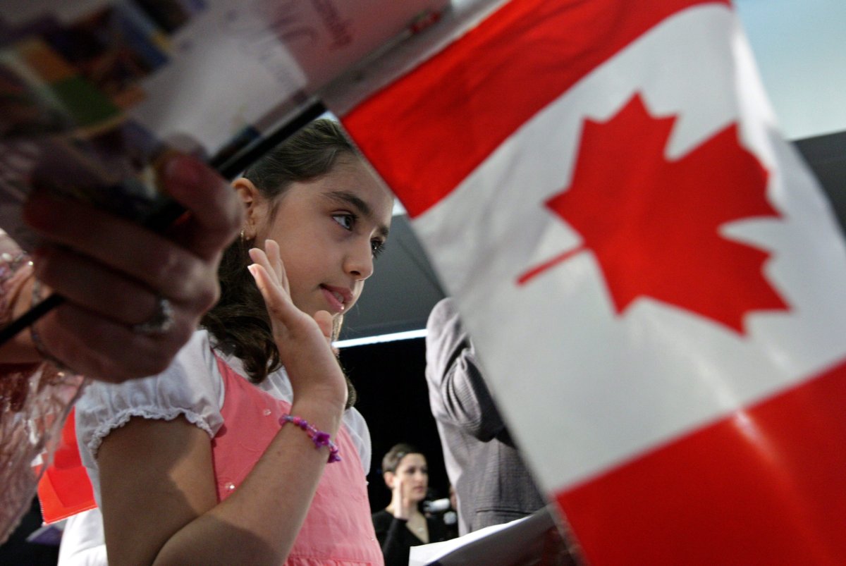 Iranian-born Negar Fakhraee, 8, takes the oath to become a Canadian citizen during a citizenship ceremony in Vancouver, B.C., on July 13, 2009. 