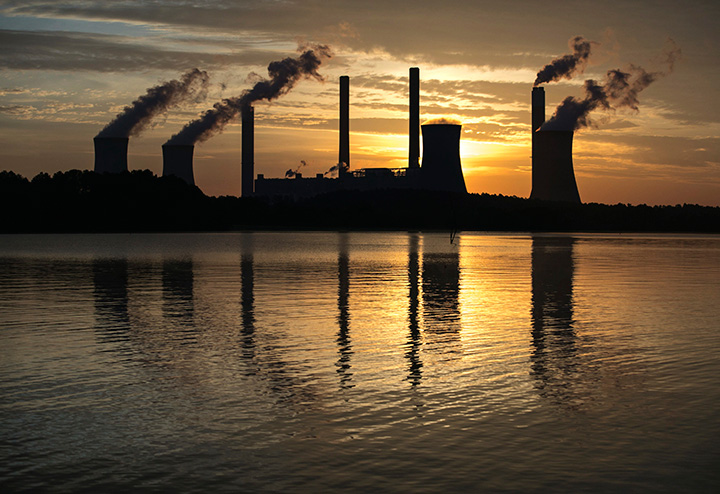 The coal-fired Plant Scherer, one of the nation's top carbon dioxide emitters, stands in the distance in Juliette, Ga., Saturday, June, 3, 2017. 
