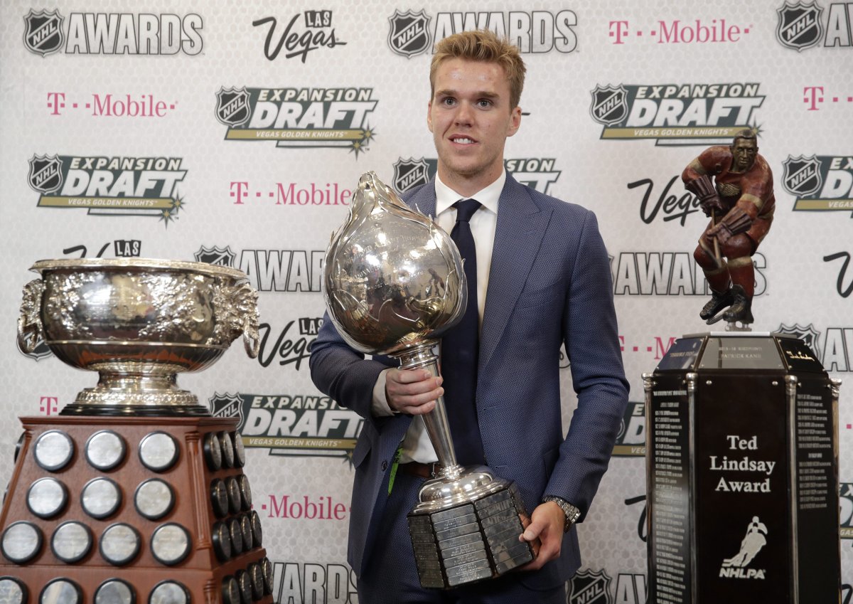 Connor McDavid of the Edmonton Oilers poses with the Art Ross Trophy, left, the Hart Memorial Trophy, center, and the Ted Lindsay Award after winning the honors during the NHL Awards, Wednesday, June 21, 2017, in Las Vegas. 