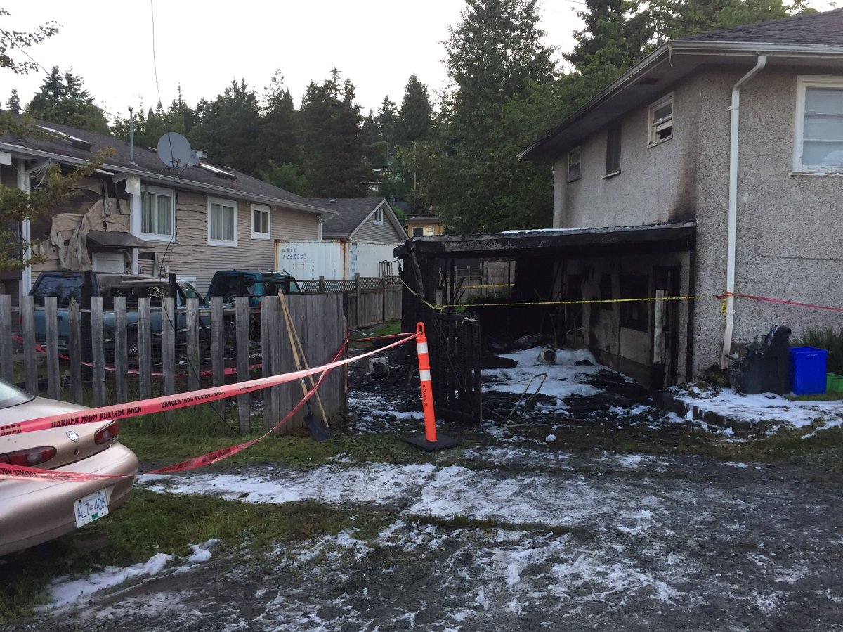 Tape is up at a home in Coquitlam Monday morning after a fire broke out.