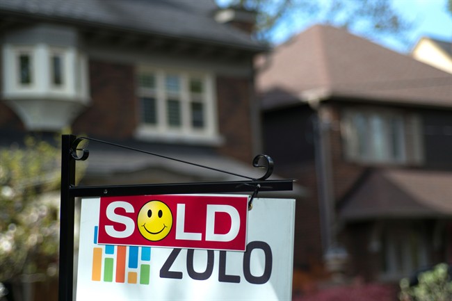 A sold sign is shown in front of a west-end Toronto home, Sunday, May 14, 2017. 