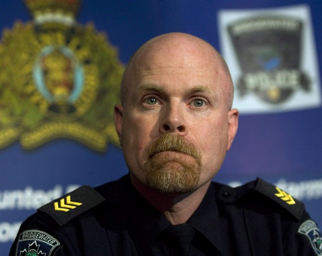 Bridgewater Police Sgt. John Collyer takes questions at a news conference regarding the death of 12-year-old Karissa Boudreau in Chester, N.S. on Thursday, Feb. 14, 2008. 