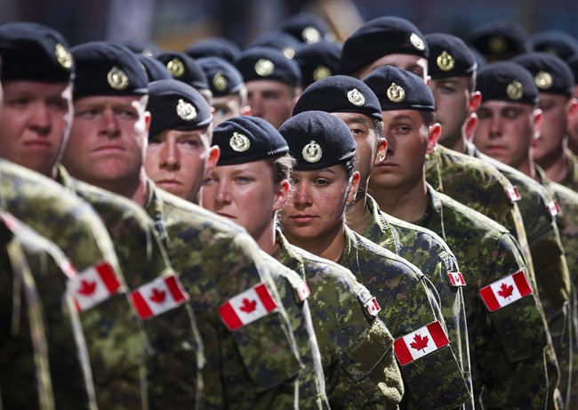Members of the Canadian Armed Forces march during the Calgary Stampede parade in Calgary, Friday, July 8, 2016.