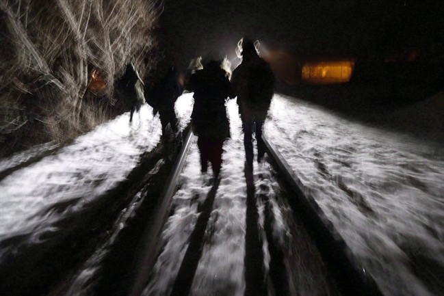 Migrants from Somalia cross into Canada illegally from the United States by walking down this train track into the town of Emerson, Man., early in 2017.