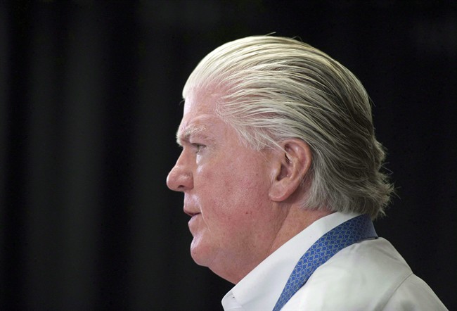 Brian Burke speaking at a media conference in April 2014. File photo.