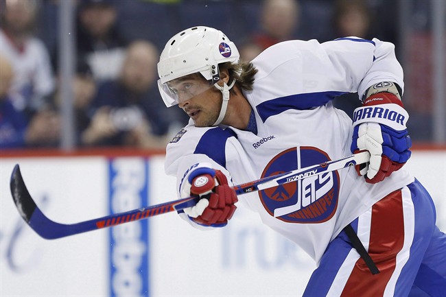 Former Winnipeg Jet Teemu Selanne takes a shot during a practice for the NHL's Heritage Classic Alumni game in Winnipeg on Friday, October 21, 2016.