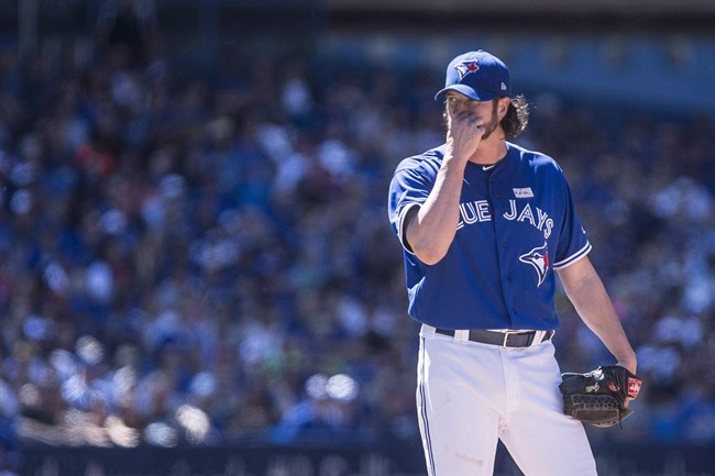 Toronto Blue Jays relief pitcher Jason Grilli reacts as he stands on the mound during eighth inning American League MLB baseball action against the New York Yankees in Toronto on Saturday, June 3, 2017. 