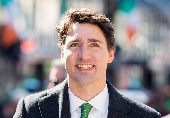 Prime Minister Justin Trudeau smiles as he participates in the annual St. Patrick's Day parade in Montreal, Sunday, March 19, 2017. 
