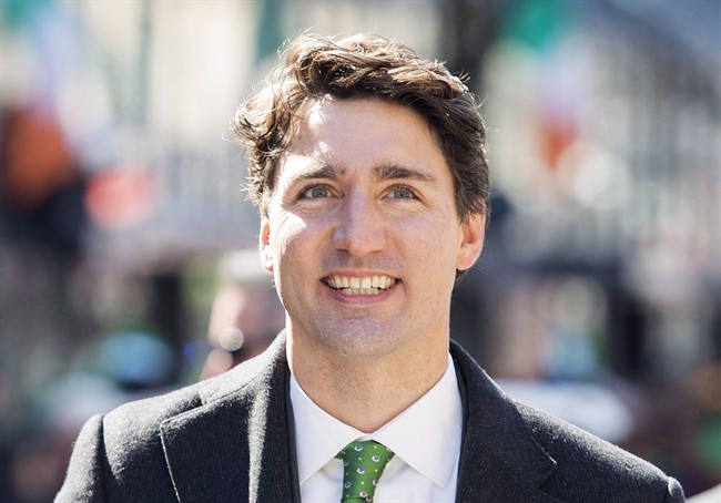Prime Minister Justin Trudeau smiles as he participates in the annual St. Patrick's Day parade in Montreal, Sunday, March 19, 2017. 