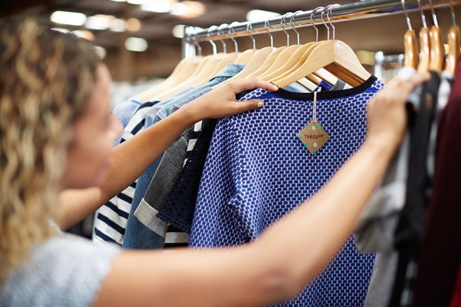 A woman looks at the selection of clothes at a ThredUp store in Toronto in this undated handout photo.