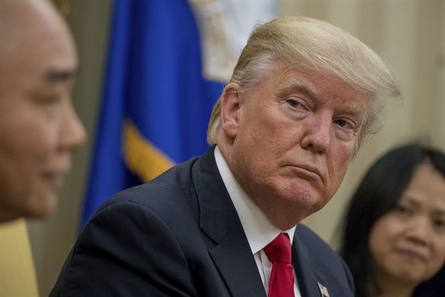President Donald Trump listens as Vietnamese Prime Minister Nguyen Xuan Phuc speaks during their meeting together in the Oval Office on May 31.