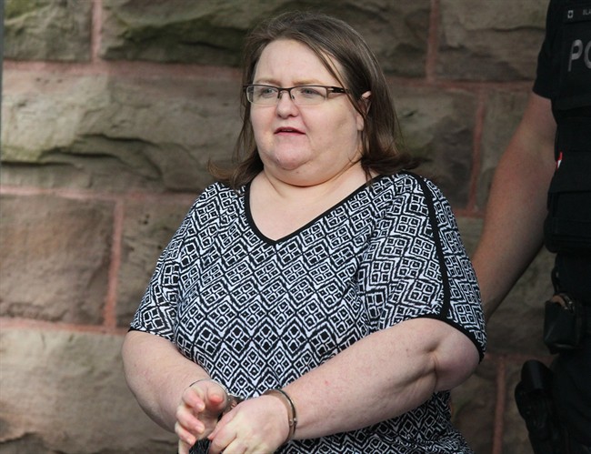 Elizabeth Wettlaufer is escorted by police from the courthouse in Woodstock, Ont, Monday, June 26, 2017. Wettlaufer, a former Ontario nurse who murdered eight seniors in her care, was sentenced to life in prison with no eligibility for parole for 25 years.