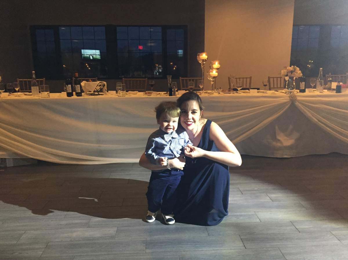 Flemming (pictured with her son, Gavin) estimates that she spent $1,700 to be her friend’s maid of honour.