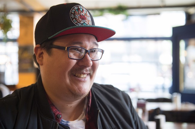 Indigenous poet Jordan Abel is shown during an interview with The Canadian Press in Toronto on Thursday, May 25, 2017. THE CANADIAN PRESS/Frank Gunn.