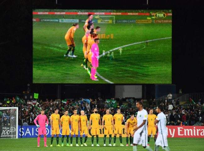 Australian soccer players observe a minutes silence prior to a 2018 FIFA World Cup qualifier versus Saudi Arabia at the Adelaide Oval in Adelaide, Australia, June 8, 2017.