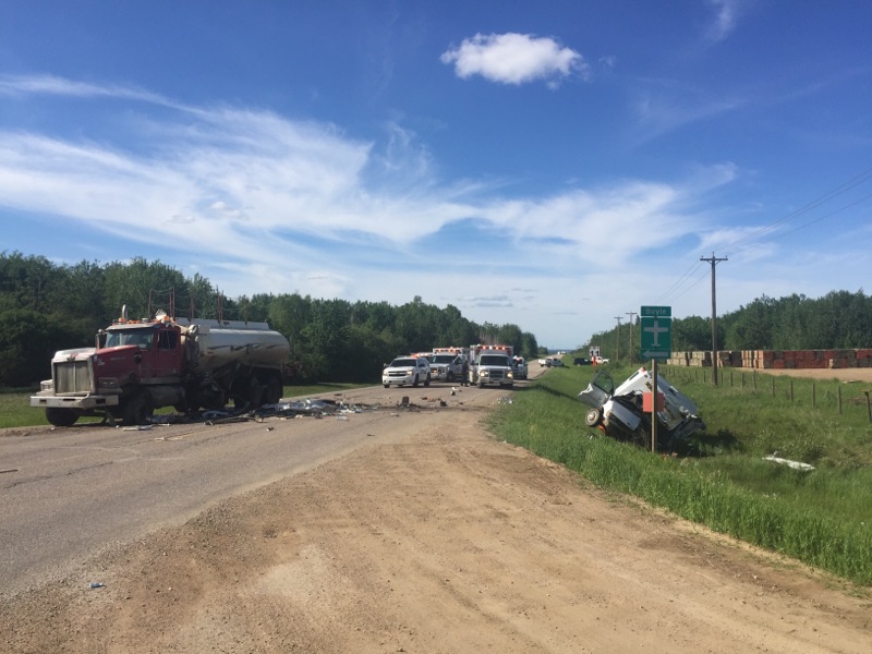 An E-350 Van collided with a semi-water truck before veering into the ditch.
