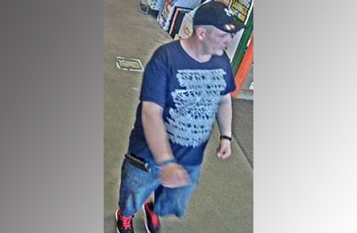 Security camera image of man to be identified in fraud investigation.