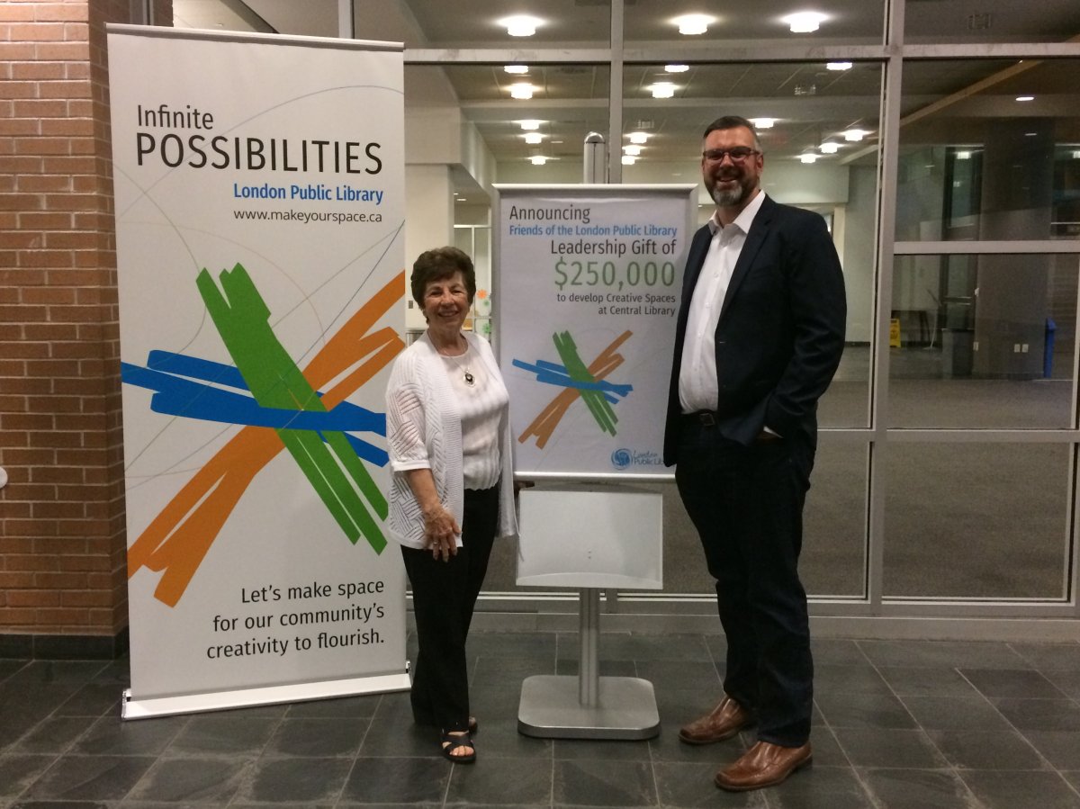 Carmen Sprovieri (left) and Scott Courtice (right) celebrate $250,000 donation from Friends .