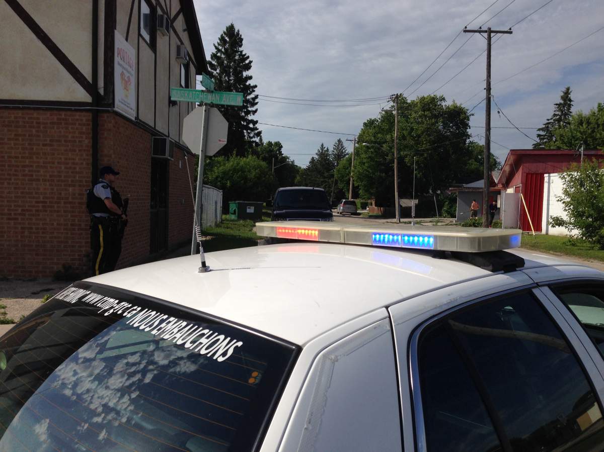 RCMP officers searched Portage la Prairie for an armed man on the loose Tuesday.