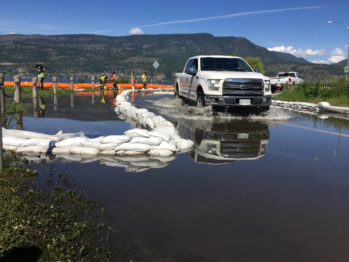 Floodwater spilling over from Okanagan Lake has partially covered Kelowna's Poplar Point Drive. 