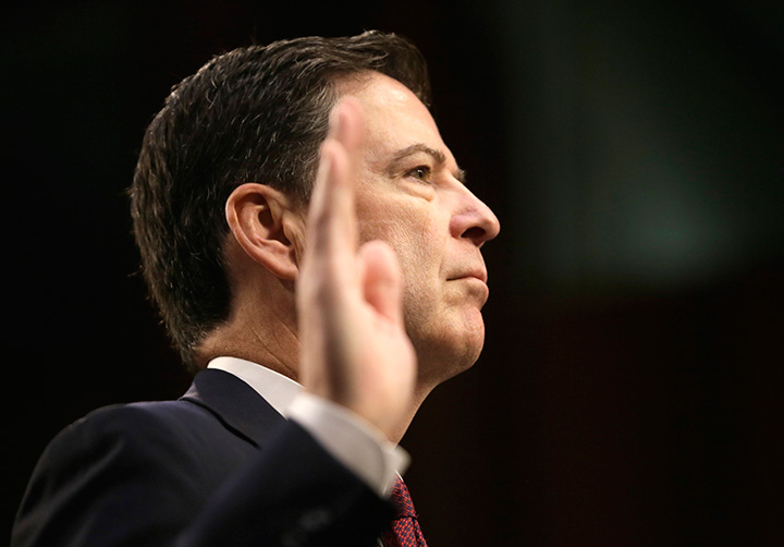 Former FBI Director James Comey is sworn in before testifying before a Senate Intelligence Committee hearing on Russia's alleged interference in the 2016 U.S. presidential election on Capitol Hill in Washington, June 8, 2017. 