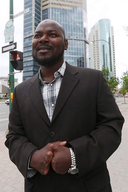 Razak Iyal, one of two asylum seekers who walked across the Canada/US border in December and lost his fingers and toes because of severe frostbite, is photographed as he enters his refugee hearing in Winnipeg, Tuesday, June 13, 2017.