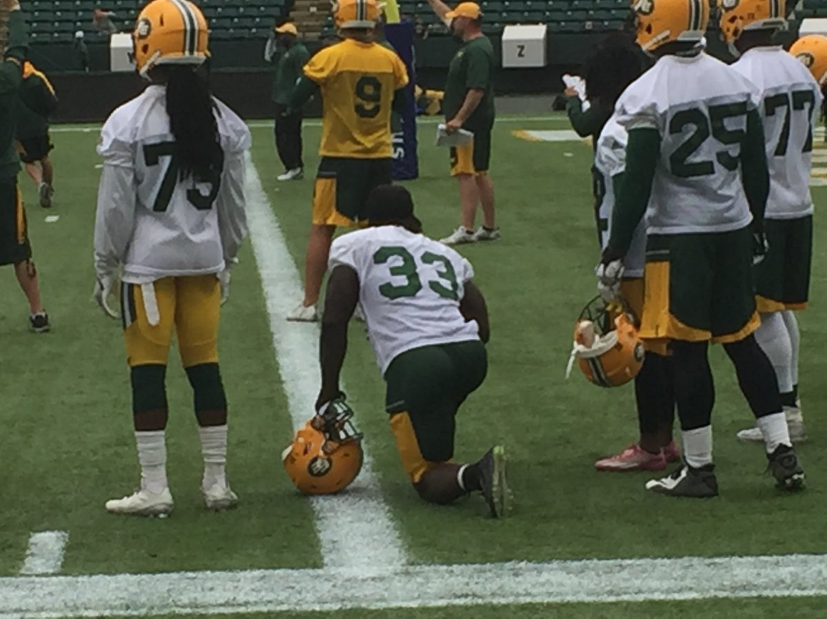 FB Johnny Augustin (33) watches Eskimos practice at training camp 2017.