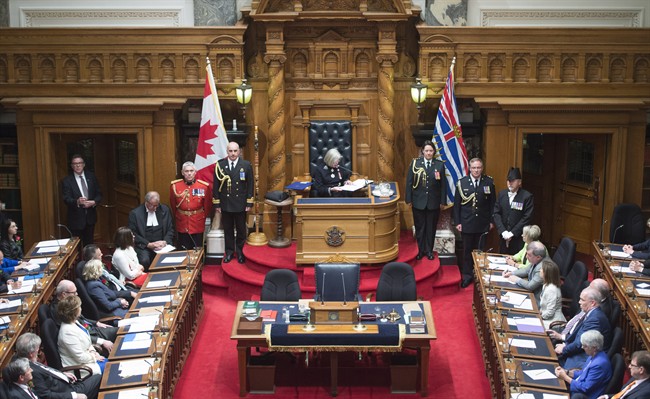 British Columbia Premier Christy Clark, left, and NDP leader John Horgan, right, look on as B.C. Lieutenant Governor Judith Guichon gives the Speech from Throne in Victoria, Thursday, June 22, 2017. 