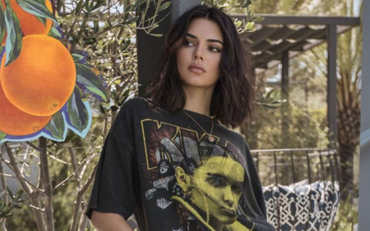 Kendall Jenner wearing one of Kendall + Kylie’s vintage tee collection designs.