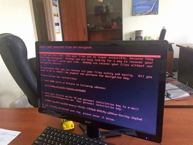 A computer screen shows the notice that computer files are being held ransom, as part of a massive international cyberattack, at an office in Kiev, Ukraine, Tuesday June 27, 2017.