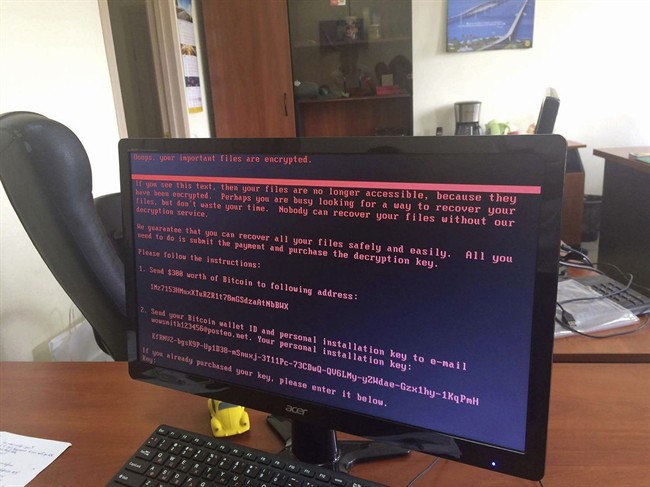 A computer screen shows the notice that computer files are being held ransom, as part of a massive international cyberattack, at an office in Kiev, Ukraine, Tuesday June 27, 2017.