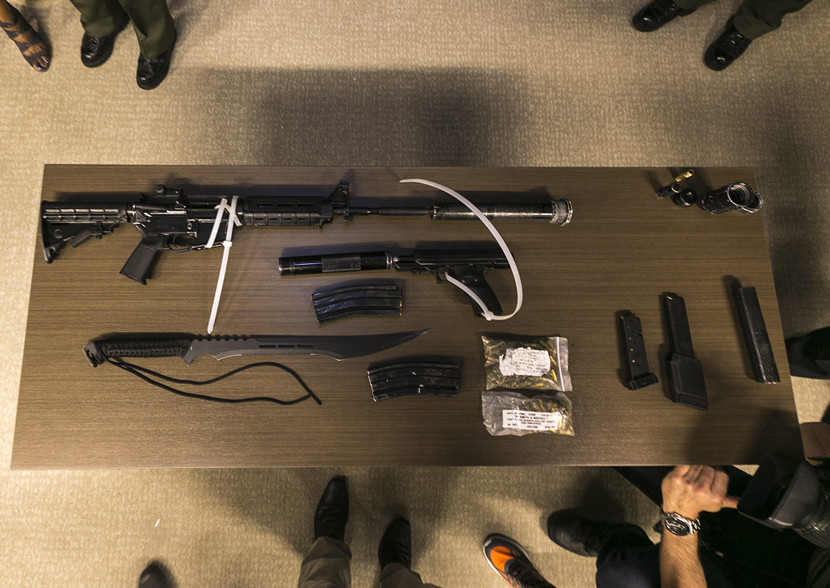 Los Angeles Sheriff department transit deputies show a cache of illegal arms found on a suspect's duffle bag after arresting him for urinating in public.
