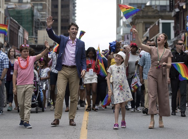 Prime Minister Justin Trudeau, his wife Sophie Gregoire Trudeau and their children Ella-Grace and Xavier walk in the Pride parade in Toronto, Sunday, June 25, 2017. 