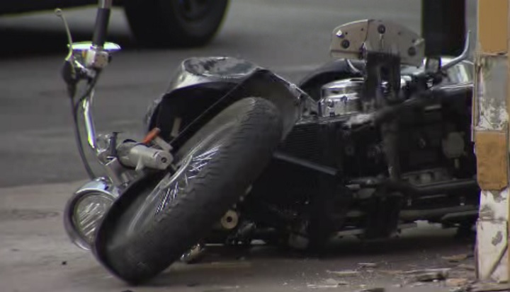 A motorcycle lays on the ground at the corner of Yonge St. and Elm St. following a collision on June 14, 2017.
