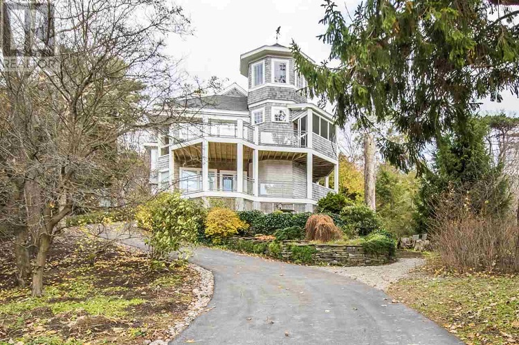 This home on the Northwest Arm features an in-ground pool, floating dock and boathouse.