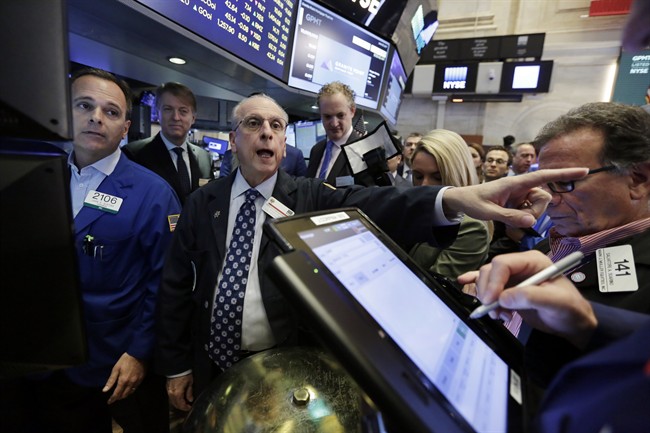 New York Stock Exchange Floor Governor Nicholas Brigandi, second left, works on the floor of the New York Stock Exchange, Friday, June 23, 2017. 