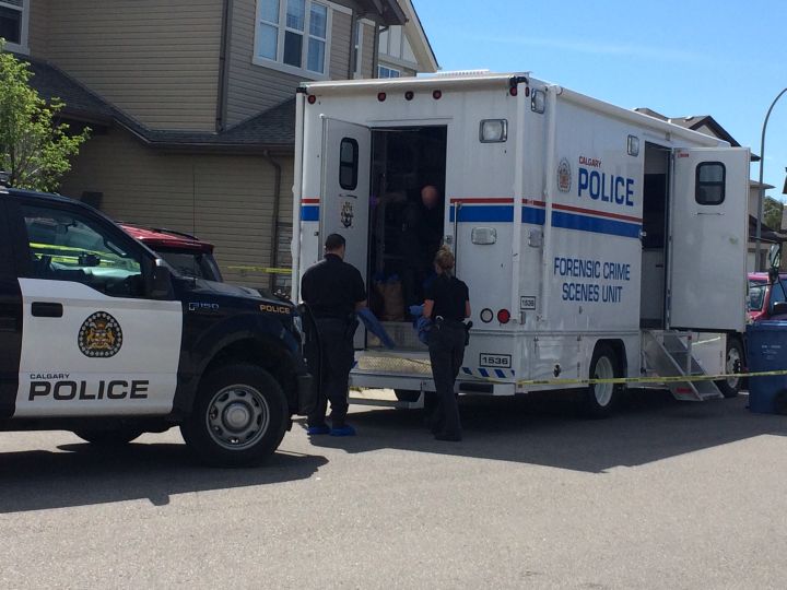 The Calgary police forensic crime scene unit is seen at the scene of a homicide investigation in Panorama Hills in June 2017.