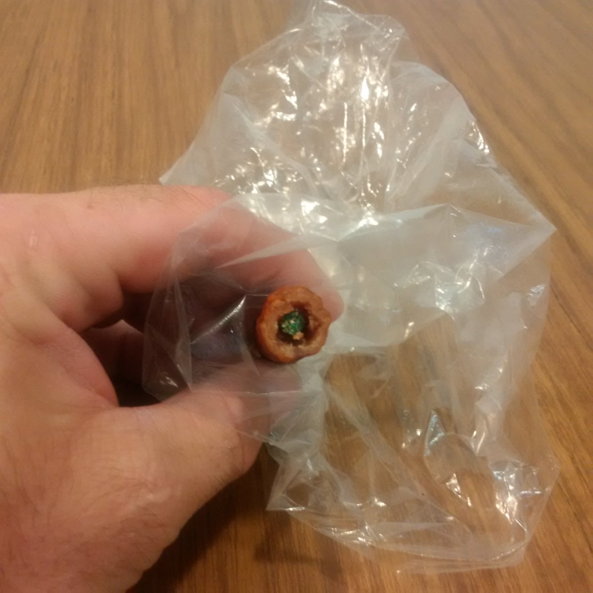 Norfolk County OPP say a hollowed out pepperoni stick filled with what appears to be poison was found on private property on June 5, 2017.