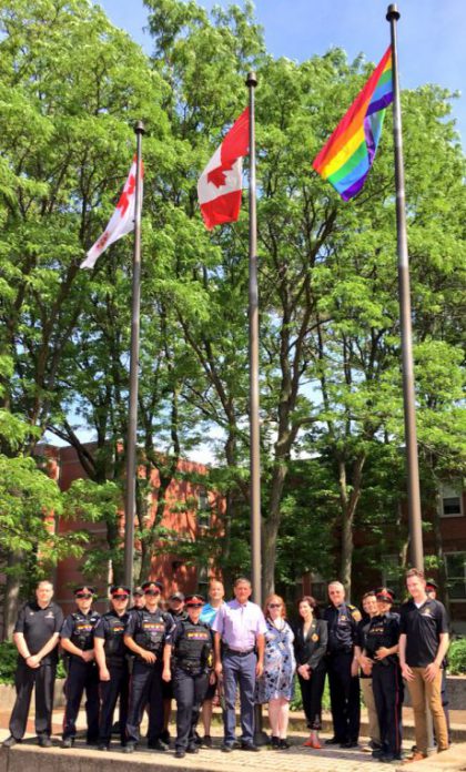 The rainbow flag flies over Hamilton's central police station after being raised Monday morning as part of Pride Month.