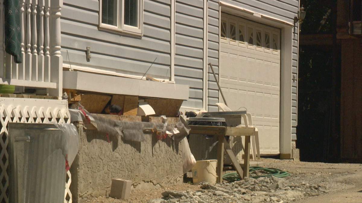 An exterior shot of some of the slumping damage at Clarke\’s Regina Beach home.