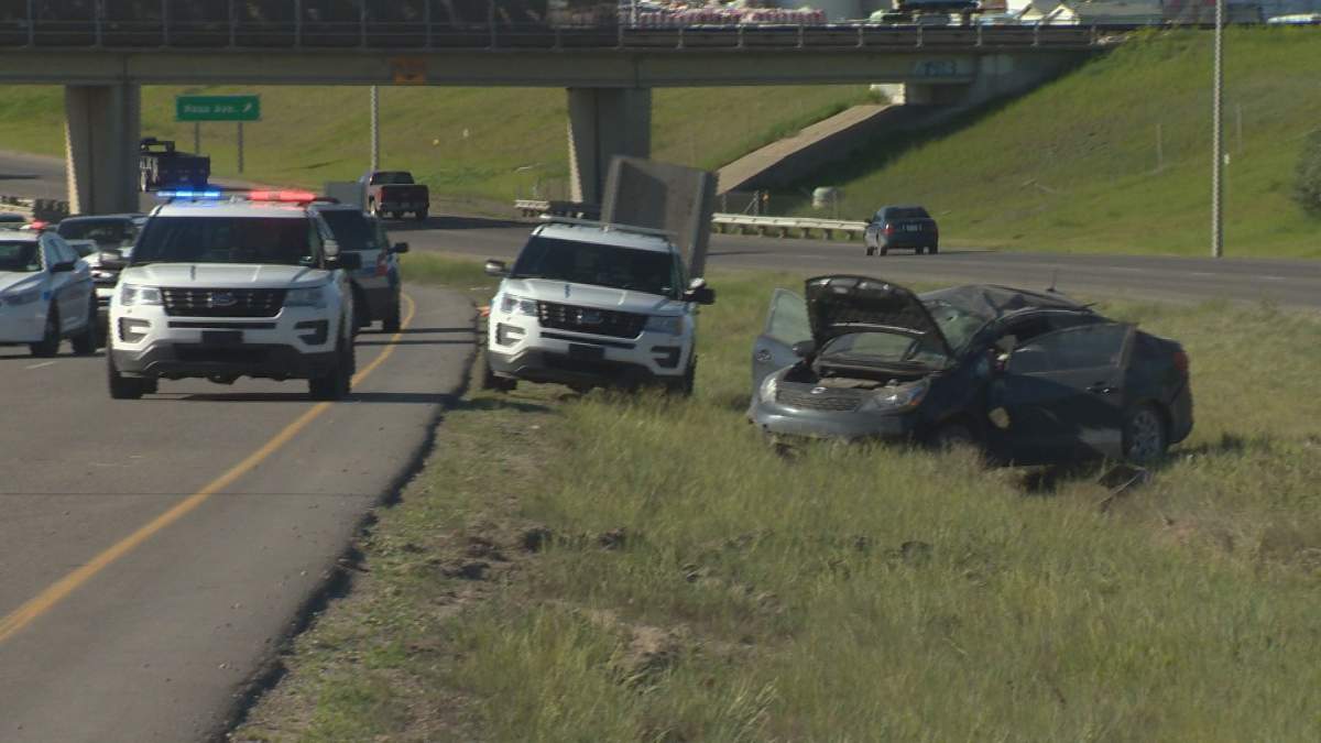 Police on scene at a single-vehicle rollover on Ring Road near the Dewdney exit.