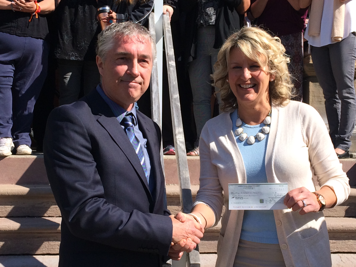 LPA executive director Rick Robson joins  Interim CEO of the Canadian Mental Health Association Middlesex Christine Sansom during a cheque presentation for My Sisters' Place on Friday, June 2.